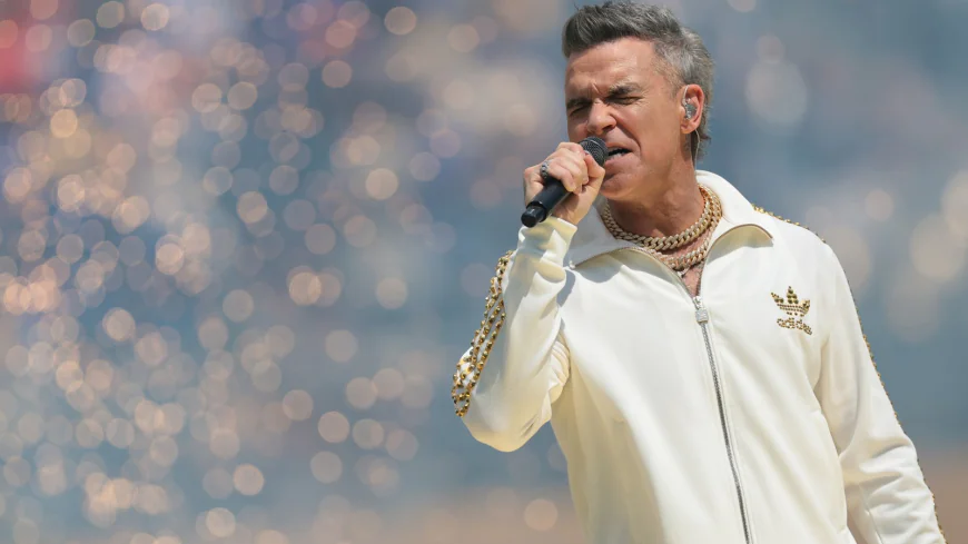 Robbie Williams Previews New Album With Anthemic Single ‘Spies’