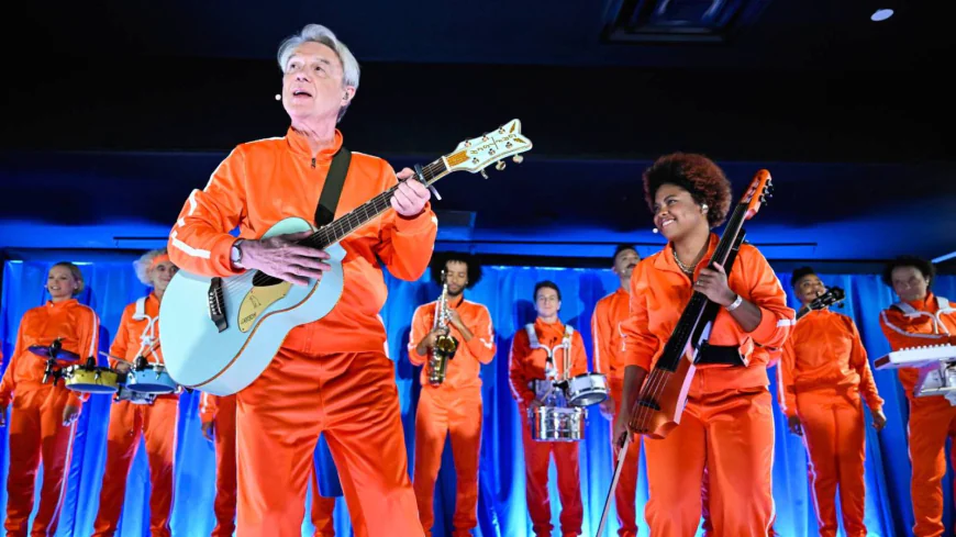 David Byrne Brings a Wave of Orange Tracksuits to Perform ‘What Is The Reason for It?’ on ‘Fallon’