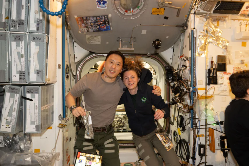 NASA astronauts Jonny Kim and Zena Cardman pose for a portrait in the Unity module
